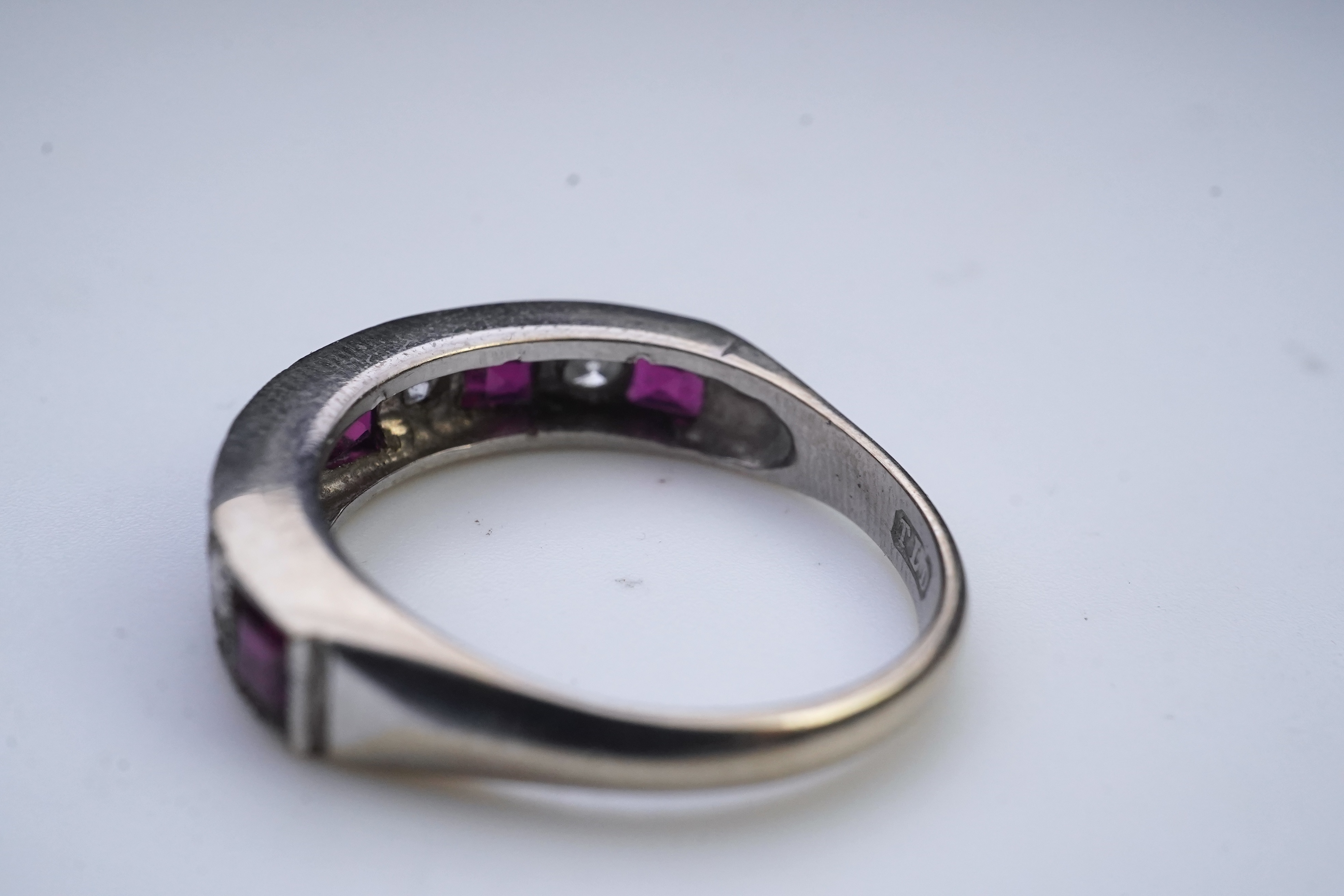 A ruby and diamond half eternity ring